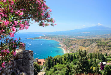Taormina town with Mount Etna on background